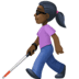 👩🏿‍🦯 woman with white cane: dark skin tone display on Facebook